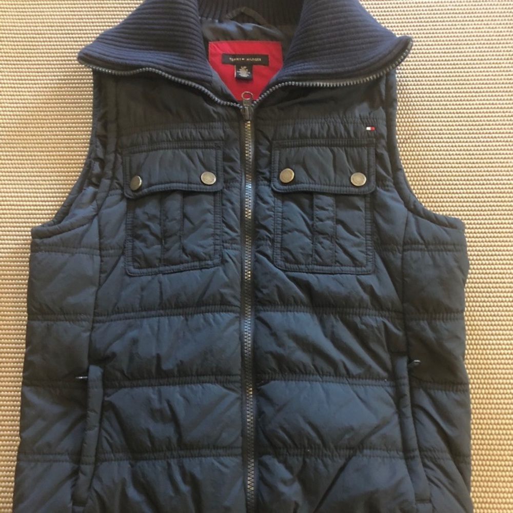 Women’s size small. Navy blue vest.